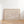 neutral beige background with white script typography the homebody club horizontal wall art