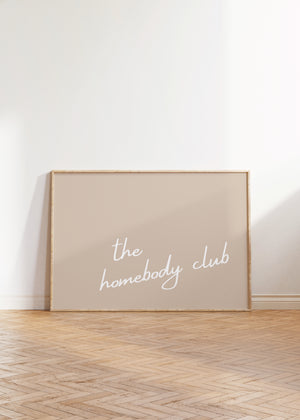 neutral beige background with white script typography the homebody club horizontal wall art