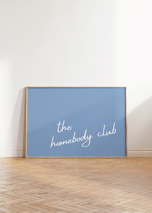 light blue background with white script typography the homebody club horizontal wall art