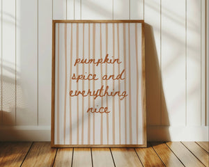 pumpkin spice and everything nice wall art quote in hand drawn script font in orange with muted orange preppy stripe background