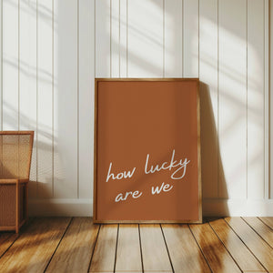 How lucky are we quote wall art burnt orange 