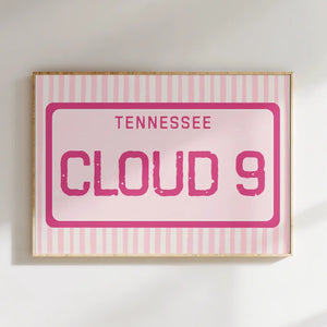 Framed pink sign with 'TENNESSEE CLOUD 9' text on a white background