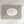 A rectangular framed wall art print with vertical olive green and white stripes, featuring a white oval center with the handwritten text 'love you, bye'. The print is mounted on a white wall with soft diagonal shadows.