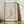 Nebraska state stamp print in vertical orientation muted orange color with corn stalks