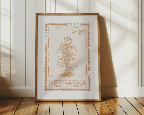 Nebraska state stamp print in vertical orientation muted orange color with corn stalks