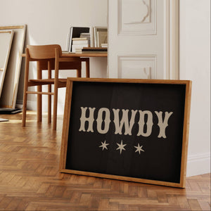 howdy in western typography on horizontal wall art in black and beige