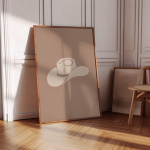 beige cowboy hat on brown background western wall art