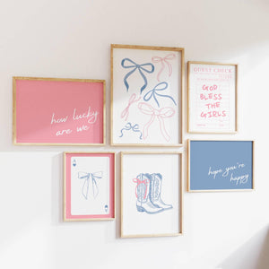 set of 6 pink and blue coquette cowgirl prints with cowgirl boots, coquette bows, ace of hearts playing card, pink how lucky are we blue hope you're happy and pink god bless the girls guest check