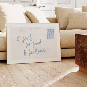 it feels so good quote on horizontal postcard print in light blue with coquette bow postal stamp