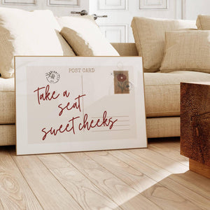 horizontal postcard print with take a seat sweet cheeks quote and vintage floral stamp