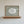 love you bye quote in hand drawn script typography on olive green striped wall art with oval cutout, horizontal wall art