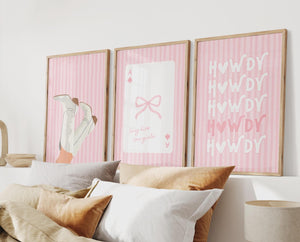 preppy cowgirl set of 3 prints in pink with cowgirl boots, ace playing card with bow and long live cowgirls quote, and howdy print with light pink stripe background