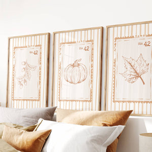 set of 3 orange fall wall art with acorn branch, pumpkin and maple leaf on retro stamp poster with vintage stripe
